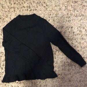 black ruffled sweater
